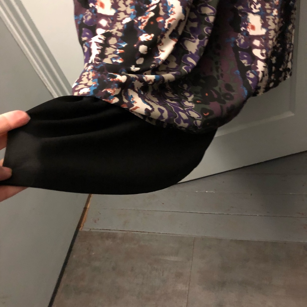 See through dress with black under garmet.